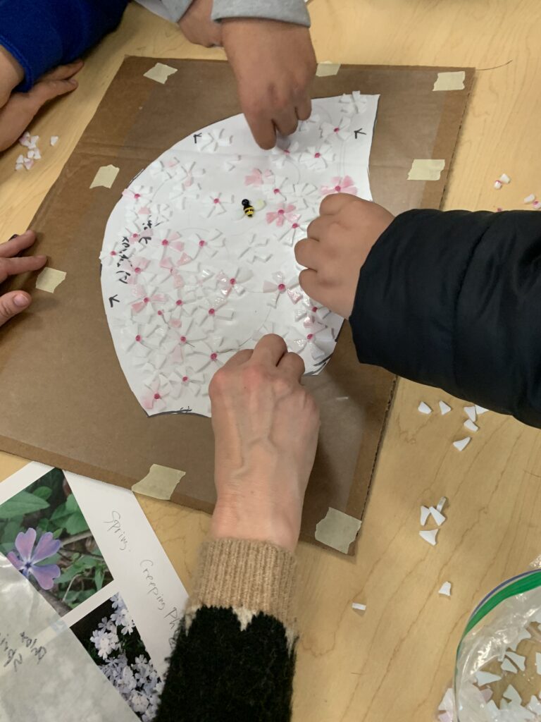 Group of students working on a mosaic.