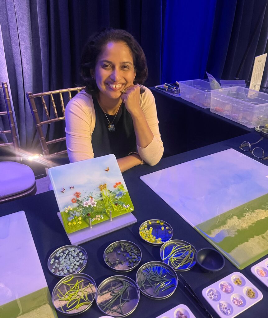 The artist along with the table set up for the project.